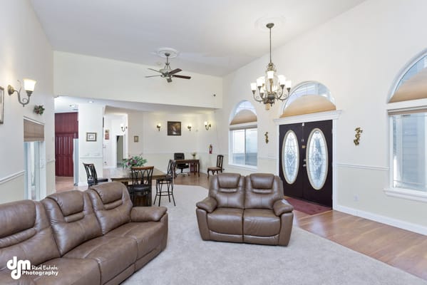 Bright common area with comfortable seating and dining setup