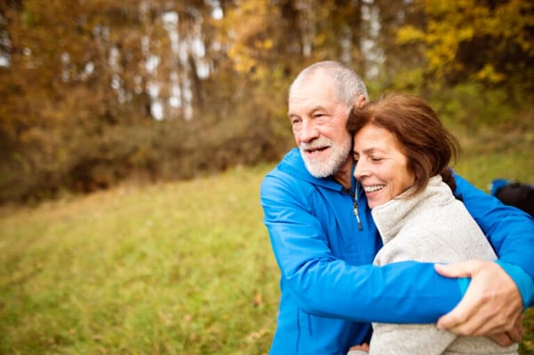 Two seniors enjoying a moment outdoors in nature