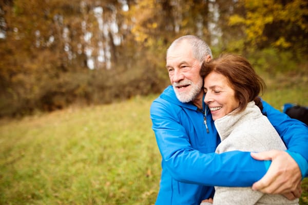 Two seniors enjoying a moment outdoors in nature