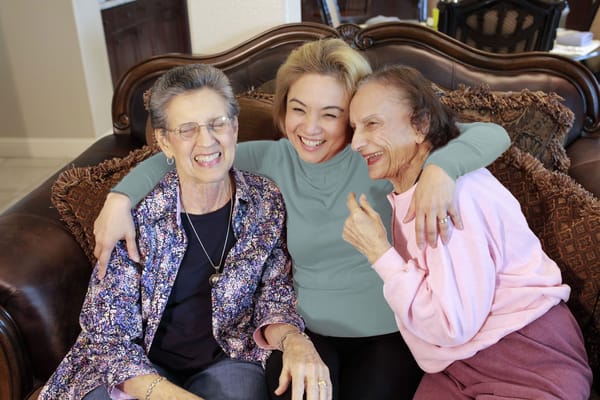 Candid photo of three women enjoying time together