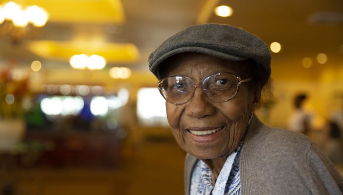 A cheerful resident in a cozy common area