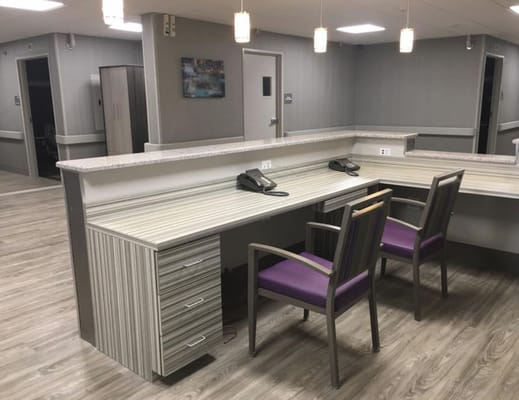 Interior reception area with seating and desk