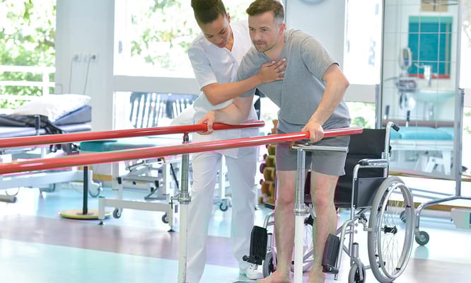 A healthcare professional assisting a patient with mobility
