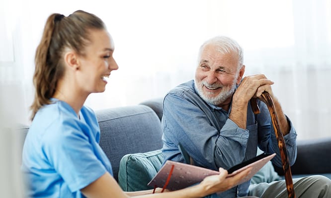 Caregiver and resident sharing a moment indoors