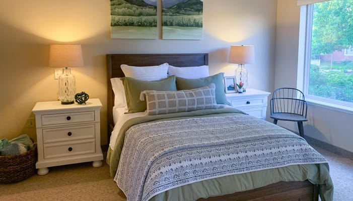 A cozy resident bedroom with soft lighting
