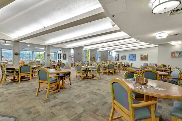 Interior view of a dining room with tables and chairs