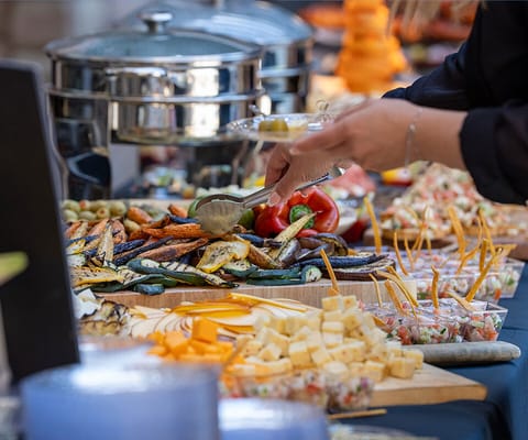 A beautifully arranged buffet with various dishes and food items