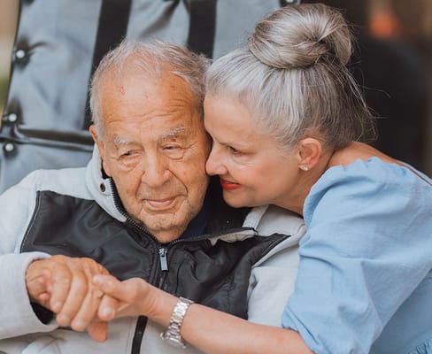 A resident and staff member sharing a moment together