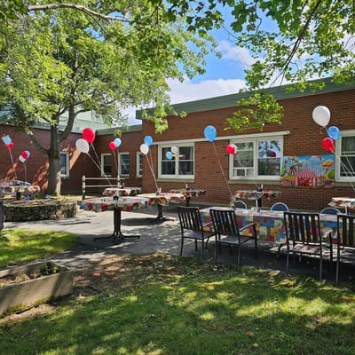 Outdoor seating area decorated for a celebration