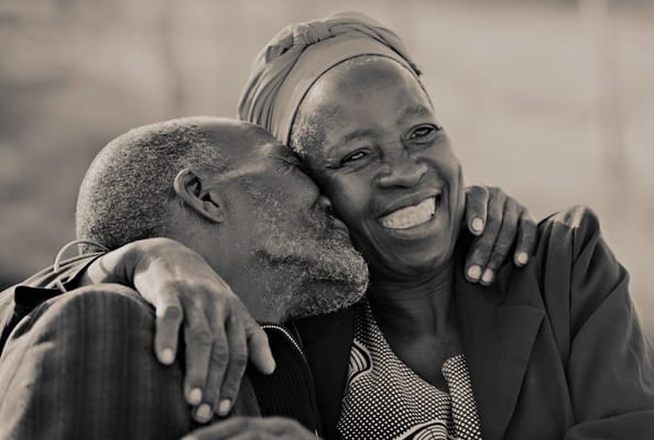 Two seniors sharing a joyful moment together