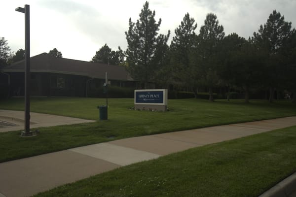 Exterior view of Quincy Place with landscaped yard