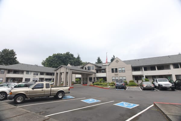 Exterior view of Solstice Senior Living with parking lot