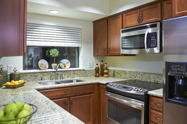 Modern kitchen with granite countertops and stainless steel appliances