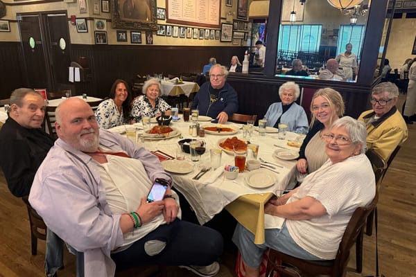 Residents enjoying a meal together at a dining table