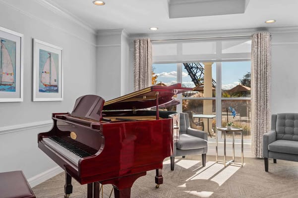 Interior common area with a piano and seating