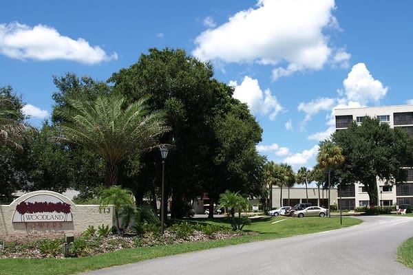 Entrance of Woodland Towers with landscaping and building
