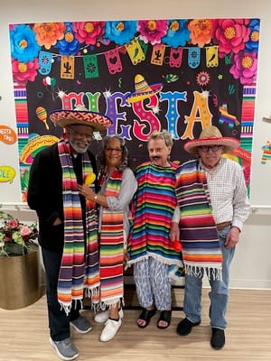 Residents celebrating in festive attire during an activity