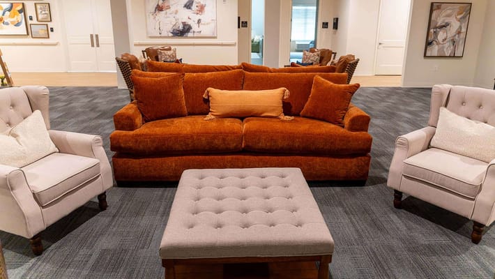 Cozy living area with a couch and chairs