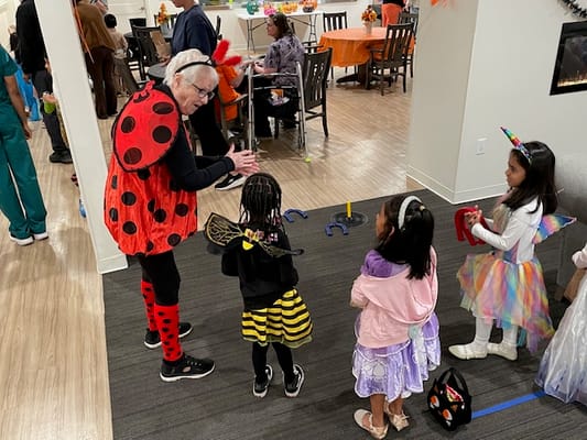 Children and staff engaging in Halloween activities