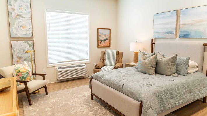 Cozy private room with a bed and seating area