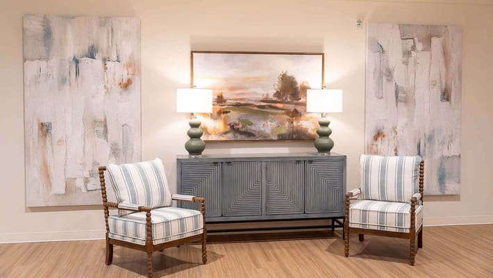 Cozy lobby area with decorative art and seating