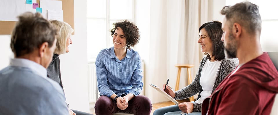 Residents and staff engaged in a group activity