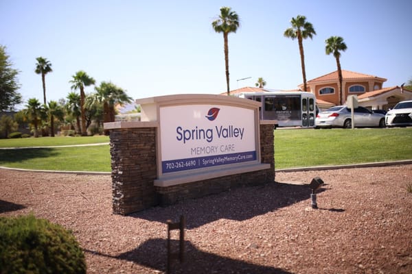 Sign for Spring Valley Memory Care in a landscaped area