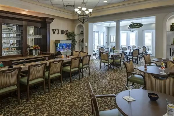 Dining area with tables and chairs in a cozy setting