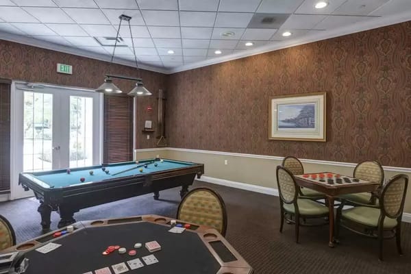 Interior common area with a pool table and seating