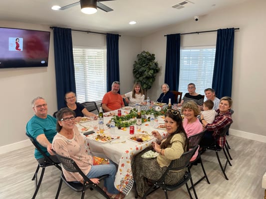 Residents enjoying a meal together at a dining table