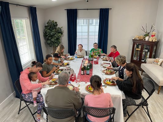 Residents and staff enjoying a festive meal together