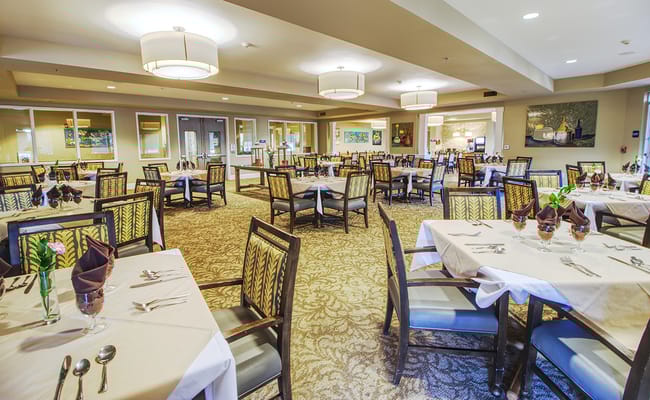 Dining room with set tables and elegant decor