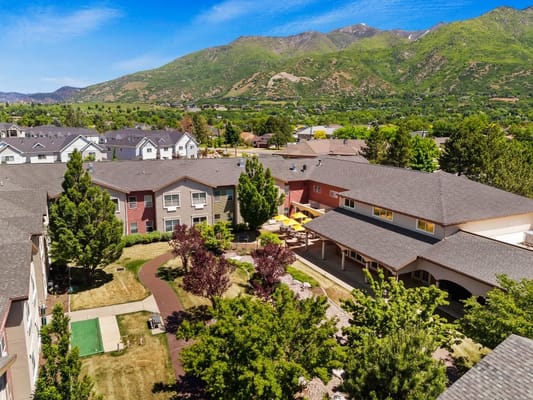 Aerial view of the facility surrounded by mountains