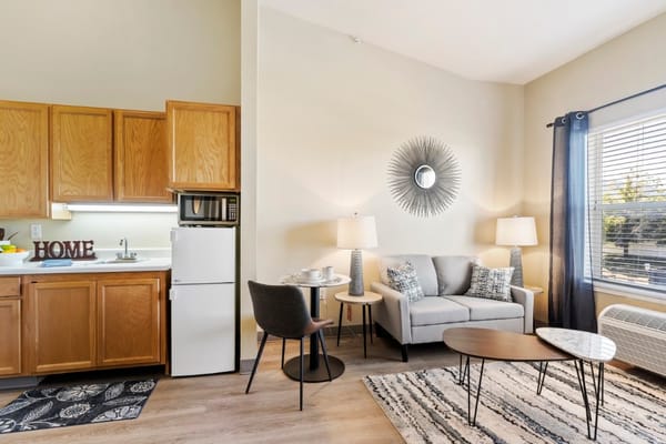 Cozy living room in a resident unit with kitchen