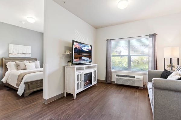 Cozy resident room with bed and TV