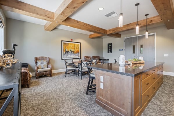 Bright common area with wooden beams and seating