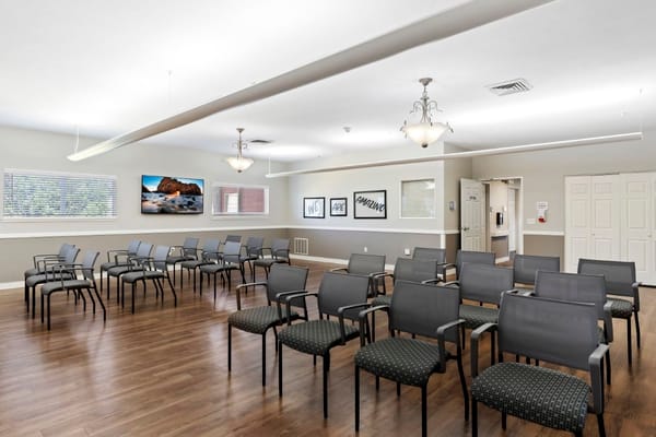 Interior view of a common area with chairs arranged for activities
