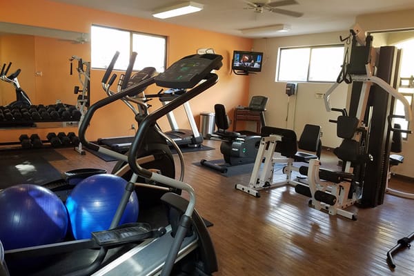 Interior view of a fitness room with exercise equipment