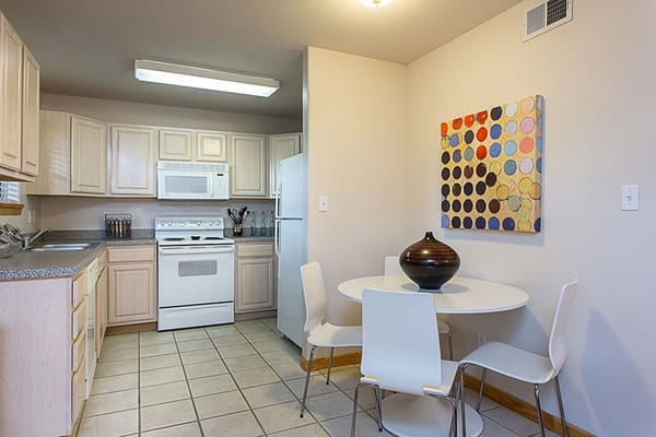 Bright kitchen area with table and chairs