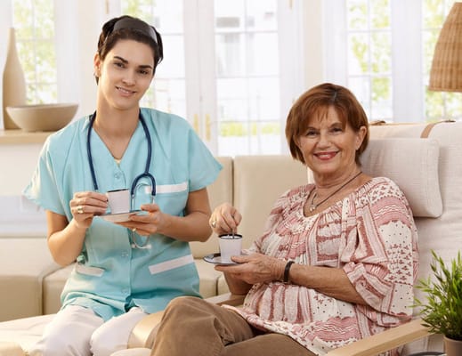 Nurse serving coffee to a resident in a senior care setting
