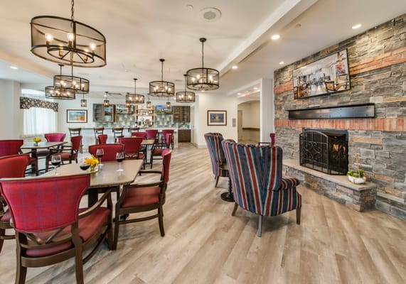 A cozy common area with seating and a fireplace
