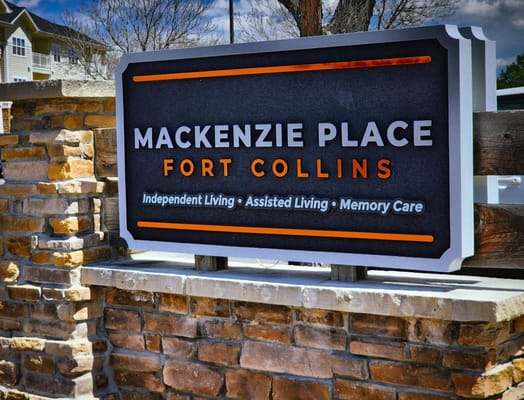 Sign for Mackenzie Place Fort Collins showing services offered.