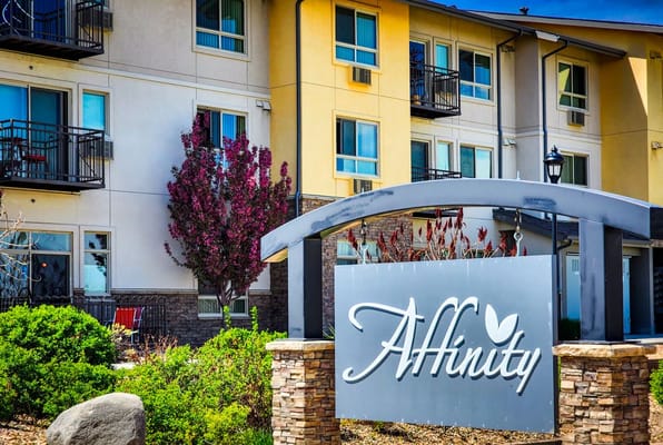 Facility sign outside the building with landscaping