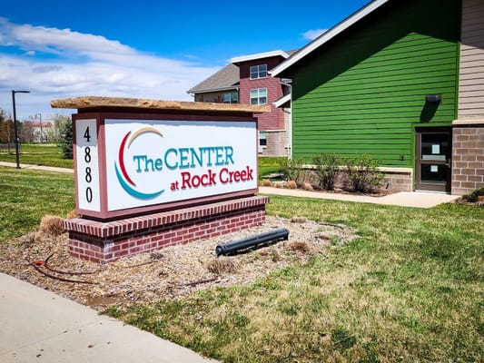 Exterior sign of The Center at Rock Creek