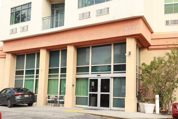 Exterior view of Sterling Aventura building entrance