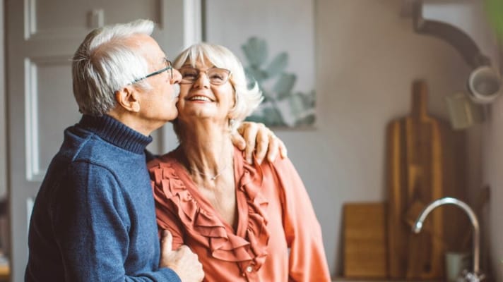 Senior couple sharing a joyful moment indoors