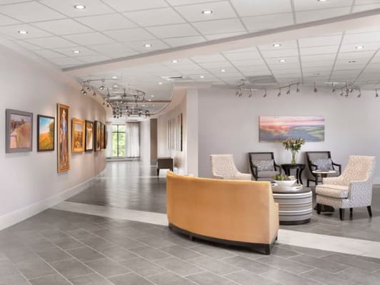 Common area with seating and artwork on the walls