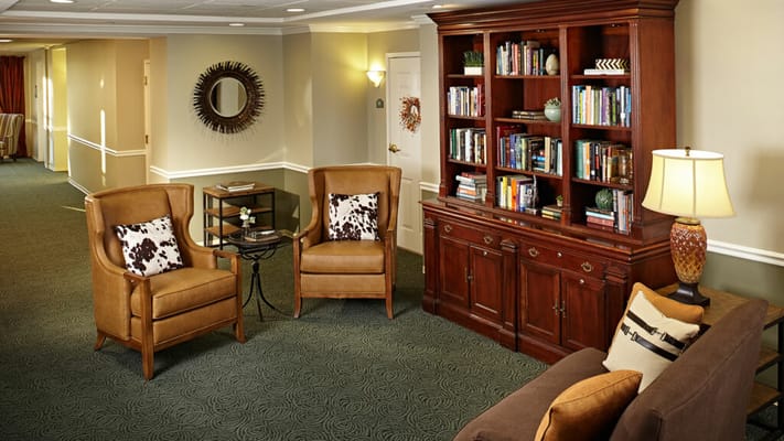 Cozy common area with seating and bookshelves