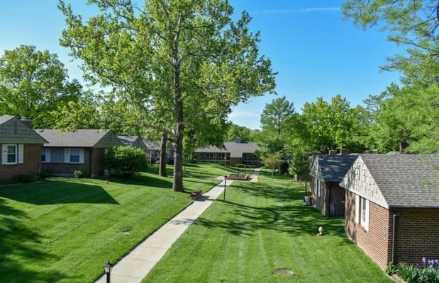 Well-maintained outdoor space with walking paths and gardens