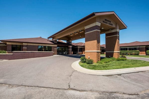 Exterior view of a nursing care facility entrance